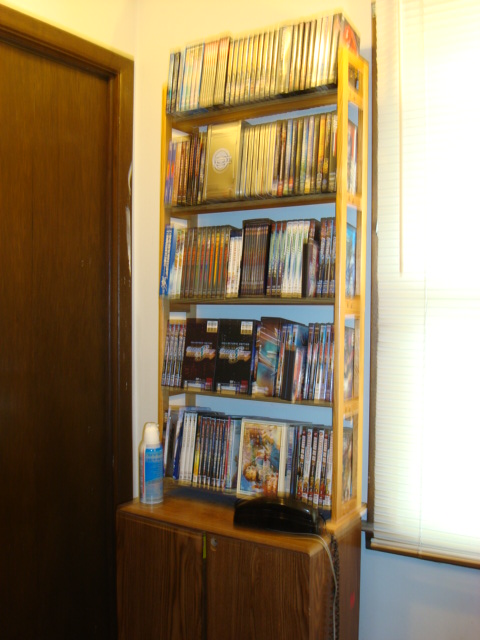 US release DVDs shelf 2 of 6. There are more DVDs in the cabinet.
