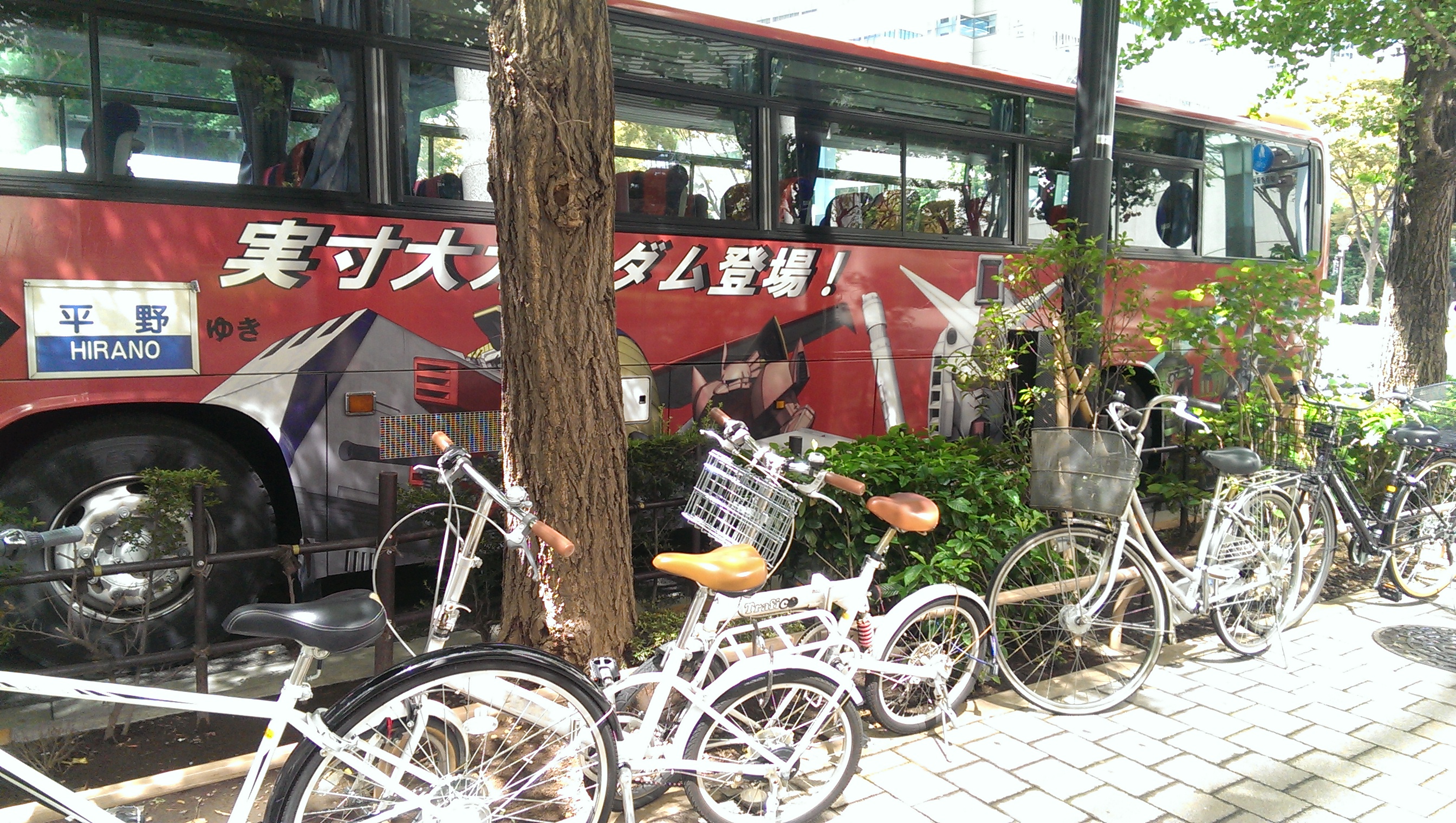 Gotta love a place where Gundam gets advertising on a bus.